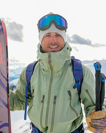 Agus Anguita on a mountain summit with his skis
