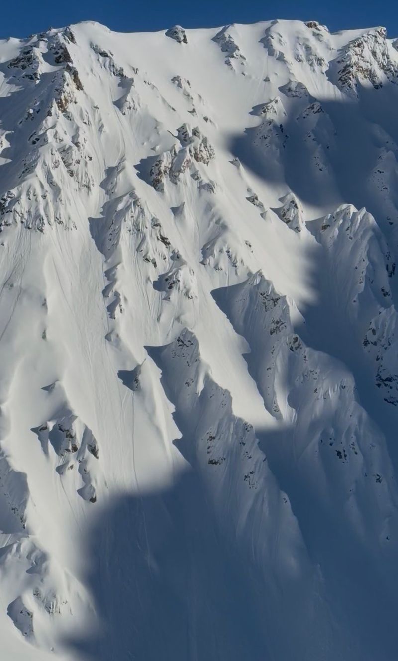 Steep snow spines in the Andes with fresh ski tracks